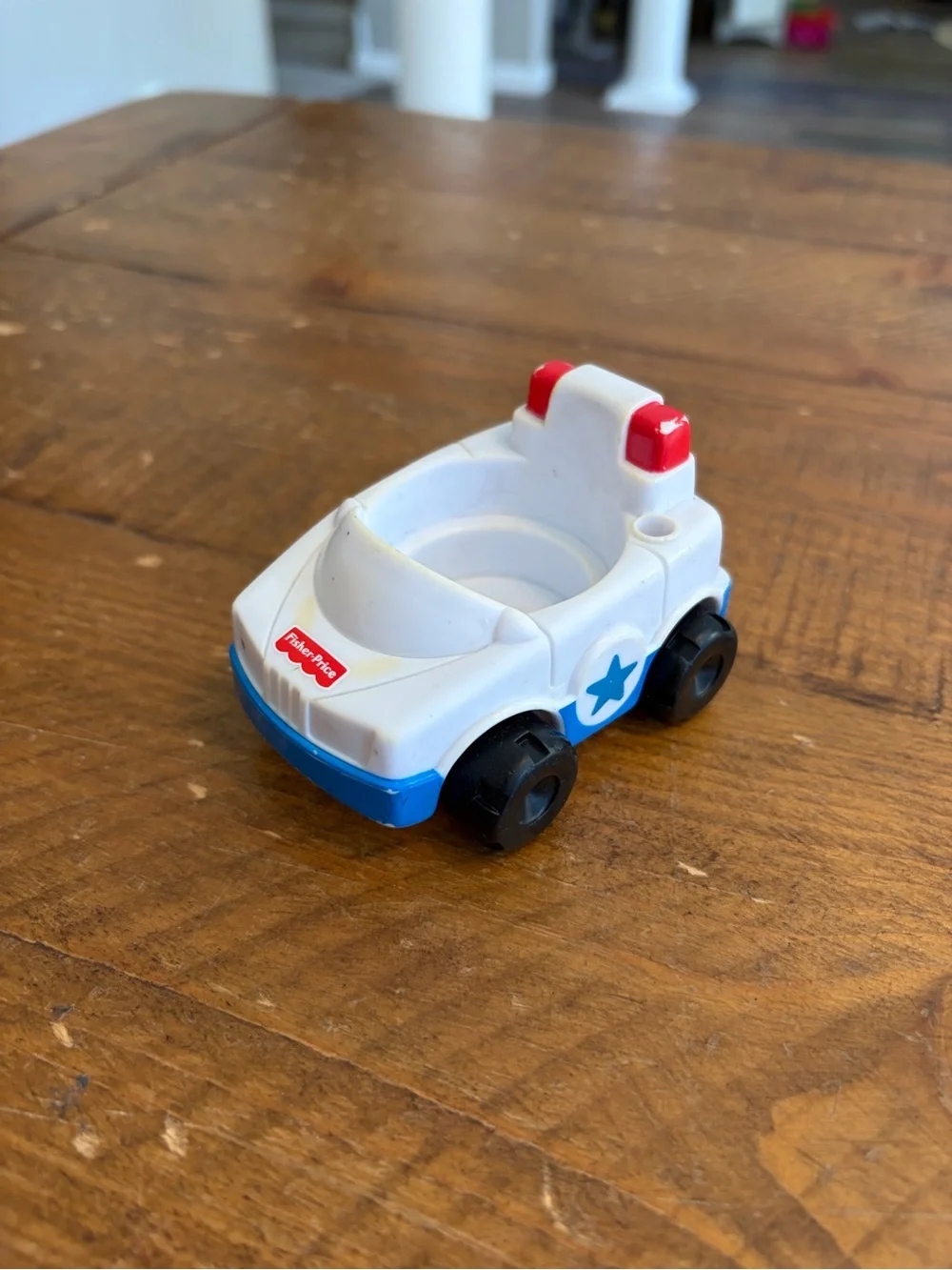 Fisher Price Little People police car as is. Has areas of yellowing see pictures